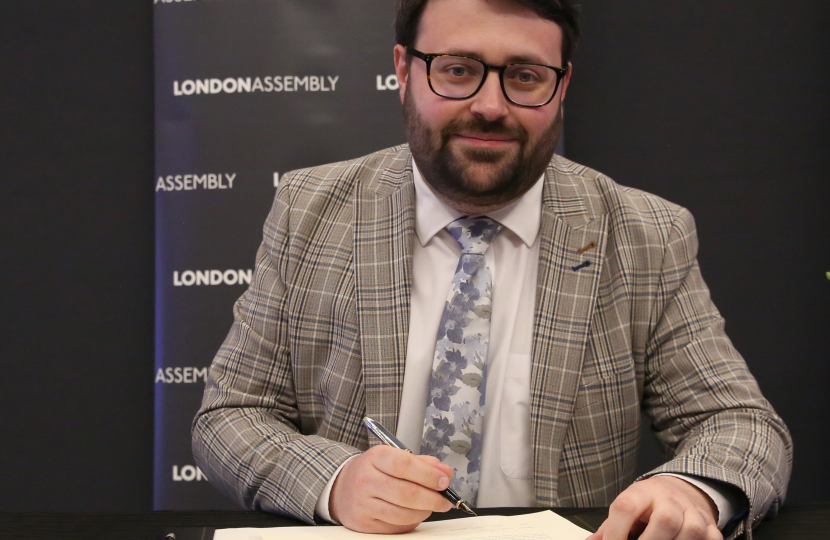 Thomas signing his declaration of office at the London Assembly in May 2024