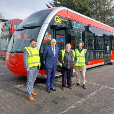 Thomas and Councillors seeing the new bus